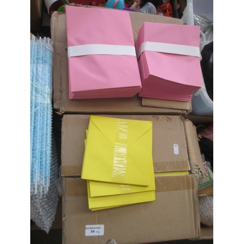 84 - Four boxes of envelopes pink and yellow