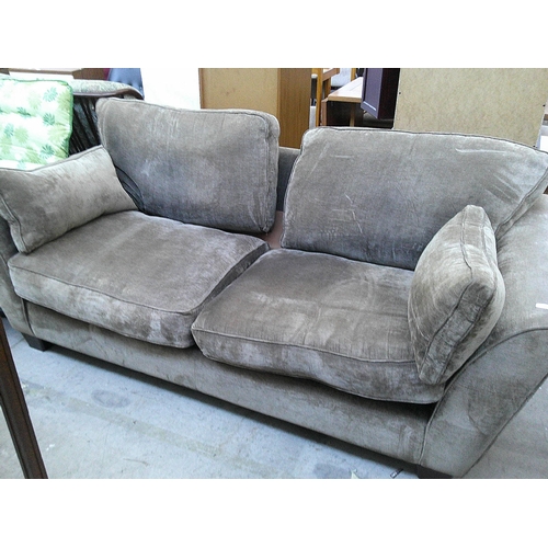 626 - A large cushioned settee