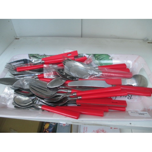 366 - Tray of red handled cutlery