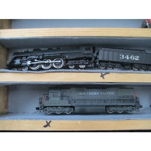 256 - Wooden display case containing miniature model rail locomotives and carriages