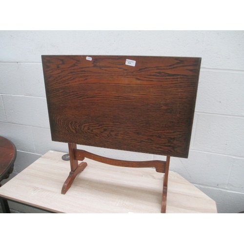 639 - A vintage tilt top oak occasional table