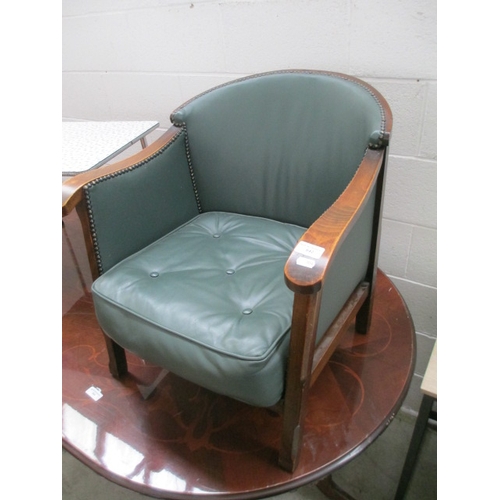 642 - A small vintage nursing tub chair with green leather cushion and panels