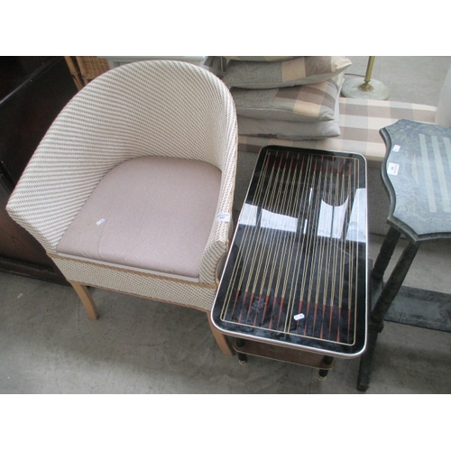 647 - A retro glass top coffee table and a woven tub chair