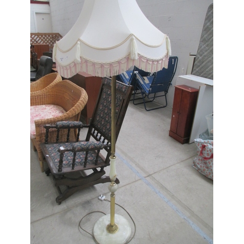 653 - A large vintage Onyx standard lamp with shade