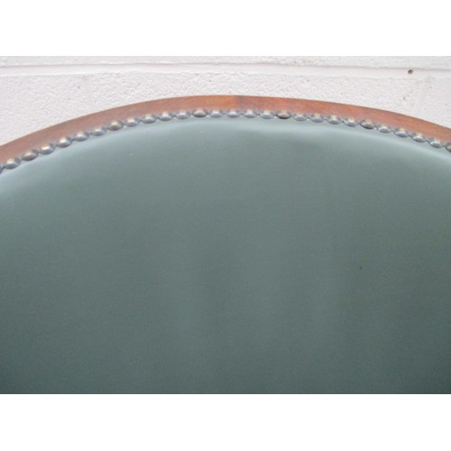 642 - A small vintage nursing tub chair with green leather cushion and panels