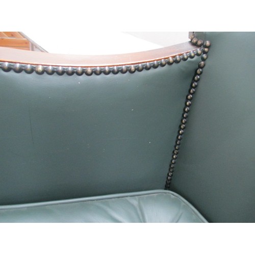 642 - A small vintage nursing tub chair with green leather cushion and panels