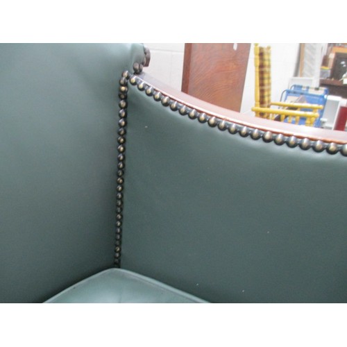 642 - A small vintage nursing tub chair with green leather cushion and panels