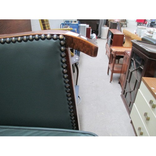 642 - A small vintage nursing tub chair with green leather cushion and panels