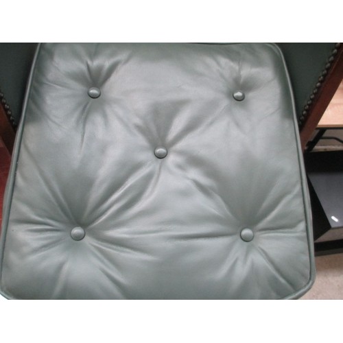 642 - A small vintage nursing tub chair with green leather cushion and panels