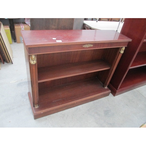 620 - A vintage open mahogany bookcase with brass decorated pillars