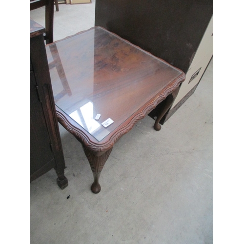 625 - A small vintage carved mahogany glass top table