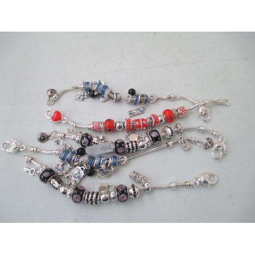 265 - Five assorted charm bracelets