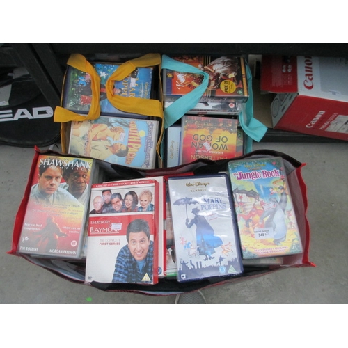 340 - Three bags inc DVDs and videos