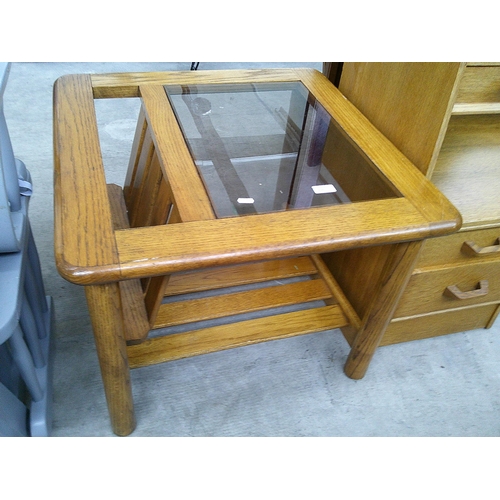 630 - A vintage 2 tier table with glass insert top and fitted magazine rack