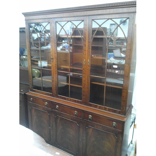 634 - A large vintage mahogany wall unit with 3 door glazed upper bookcase on 3 drawer triple cupboard bas... 