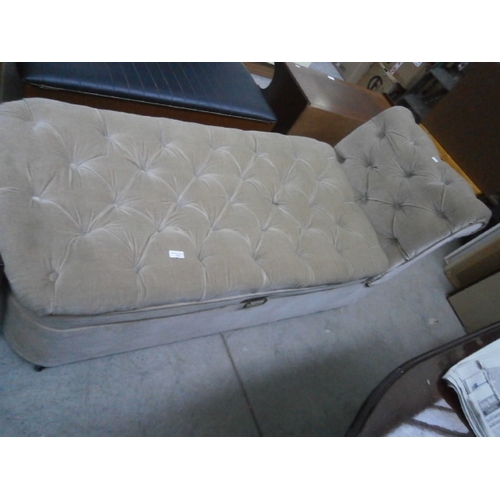 631 - A buttoned Chaise Longue with tilting end arm and lift off seat for storage box