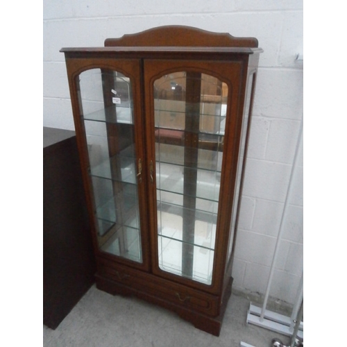 632 - A vintage glazed display cabinet with lower drawer