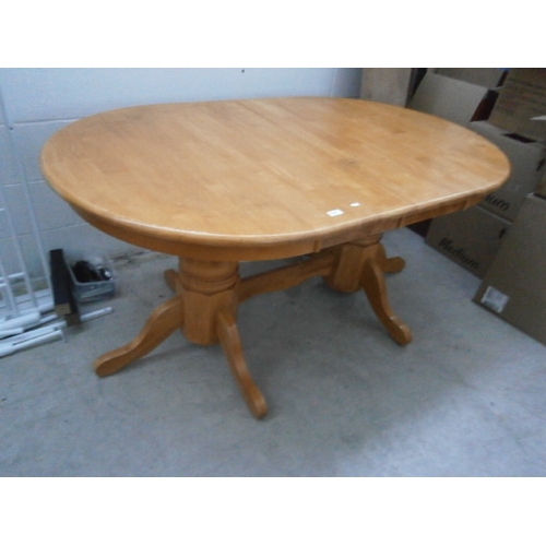 634 - A large twin pedestal extending dining table