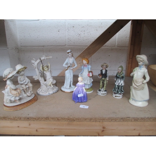 28 - Eight assorted figurines inc Royal Doulton Marie