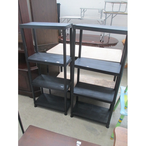 627 - A pair of 4 tier stacking plastic shelf stands