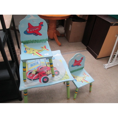 628 - A child's play table and 2 x matching chairs