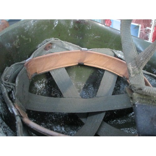 181 - Two vintage military helmets