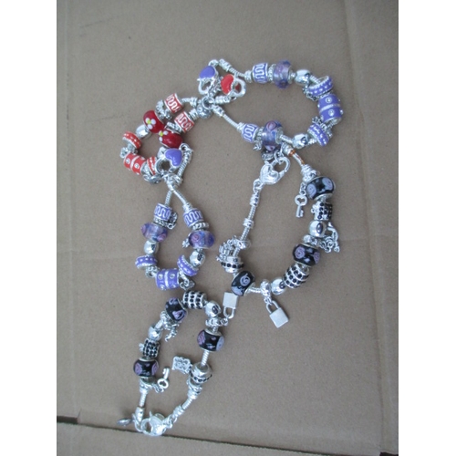 234 - Five assorted charm bracelets