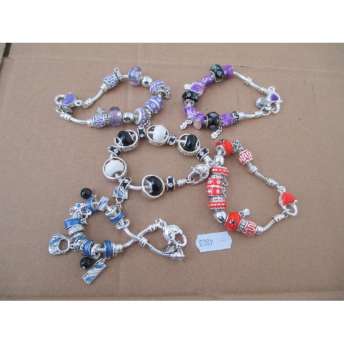 235 - Five assorted charm bracelets