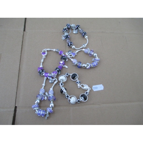 237 - Five assorted charm bracelets