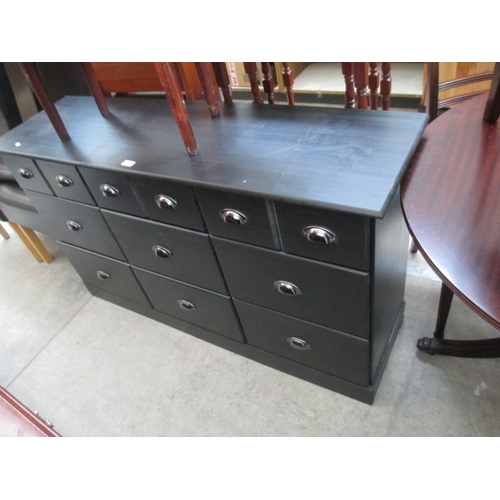 666 - A modern black 9 drawer chest base sideboard unit