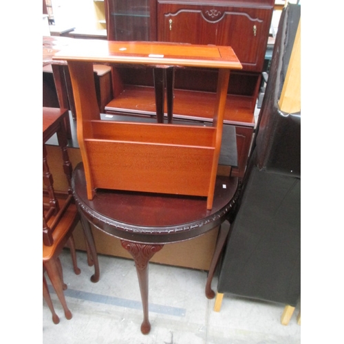 669 - A vintage carved mahogany demi lune table and a magazine rack