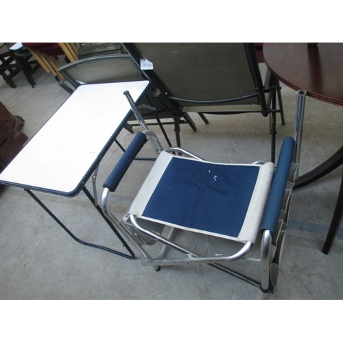 671 - A small folding camping table and a folding seat