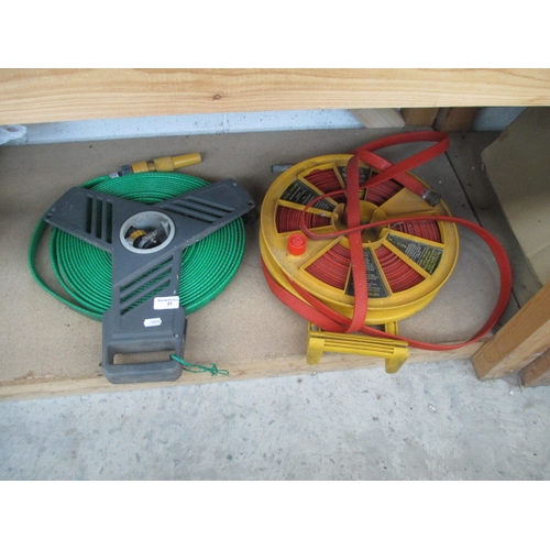 21 - Two flat hose and reel sets