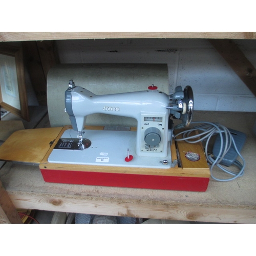 28 - Jones sewing machine with case, working