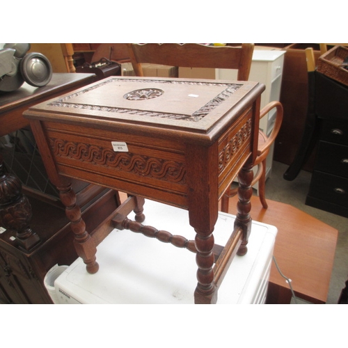 613 - An ornately carved vintage oak lift top storage box on bobbin turned frame