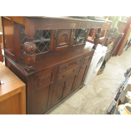 618 - A vintage carved 2 drawer Court Cupboard with lead glazed cabinets