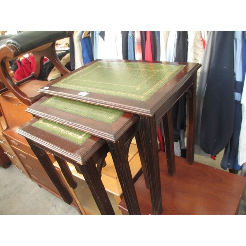 636 - A nest of 3 x vintage occasional tables with leather in serts