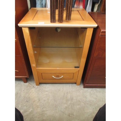 637 - A small glazed music cabinet with drawer