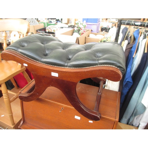 638 - A vintage mahogany buttoned leather stool