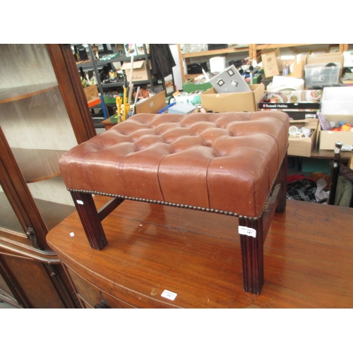 641 - A vintage buttoned leather stool