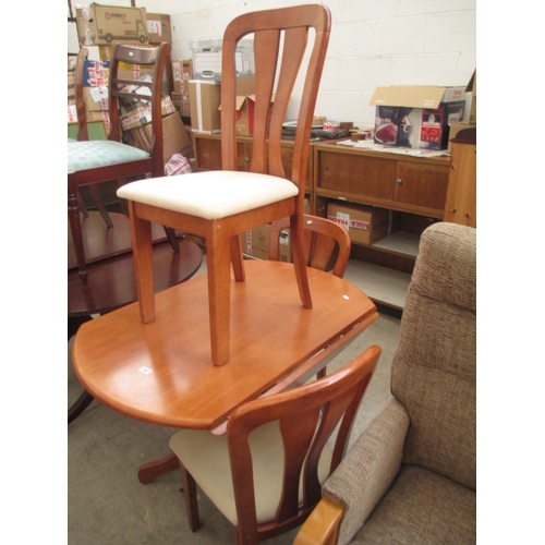 687 - A modern drop leaf pedestal dining table and 3 x chairs