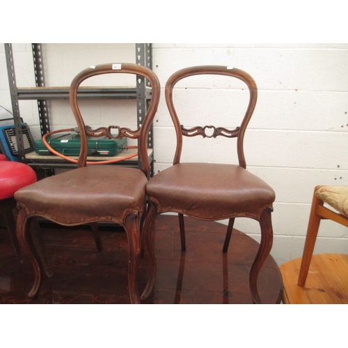 690 - A pair of antique spoon back stand with cabriole legs and padded leather seats