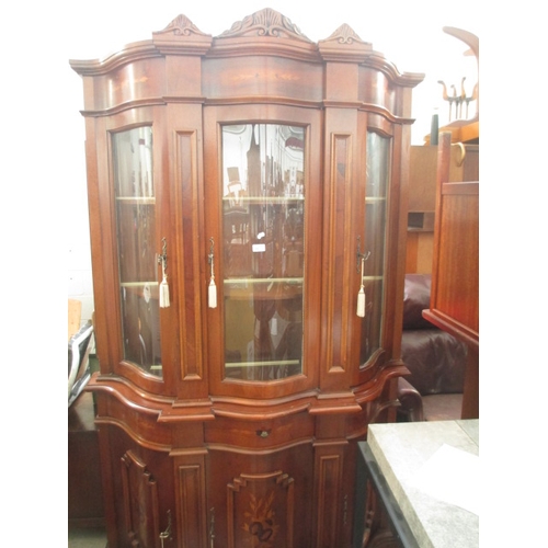 695 - A large vintage glazed cabinet with curved glass upper doors and inlaid panels