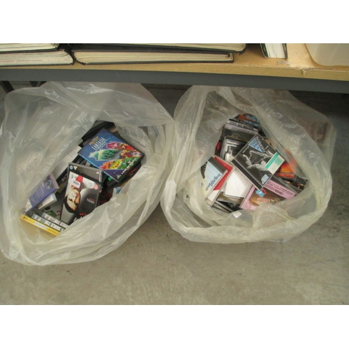 105 - Two bags containing quantity of CDs and DVDs