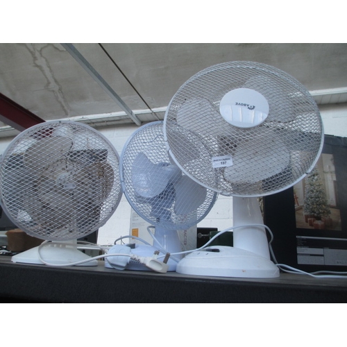 197 - Three assorted desk fans. Two work fine one has power but blades need attention