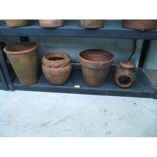 401 - Four assorted terracotta pots