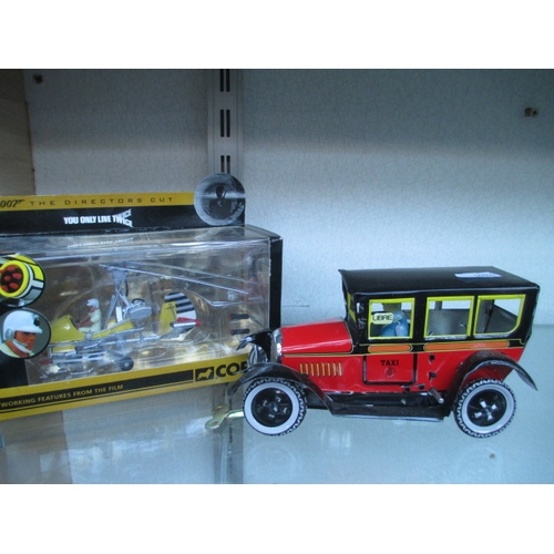 429 - Lot inc Corgi 007 model and wind up aluminium taxi