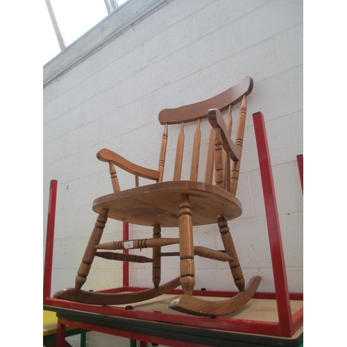 682 - A vintage wooden spindle backed rocking chair