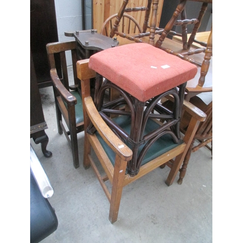 662 - 2 x vintage wood framed elbow chairs, a cane framed stool and a magazine rack