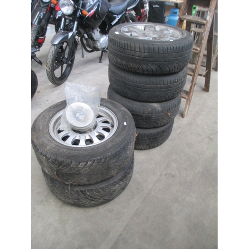 516 - Set of four and set of two BMW wheels, as found